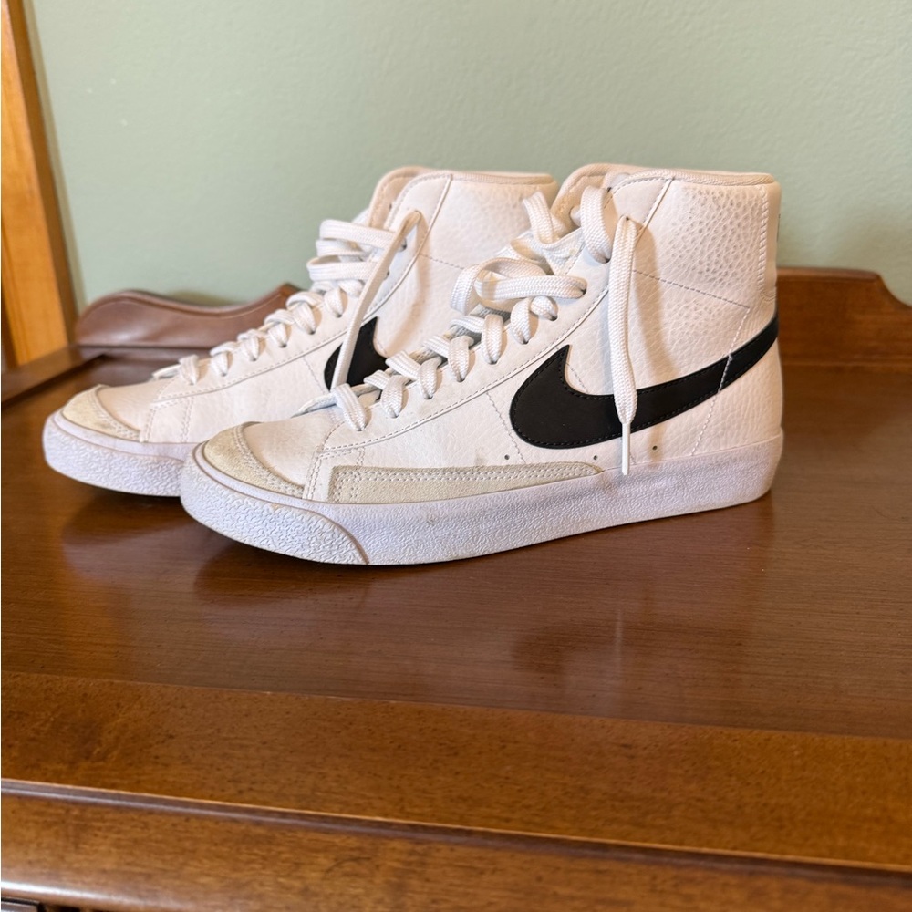 Nike White High-Top Sneakers with Black Swoosh